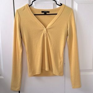 yellow v neck button down long sleeve top